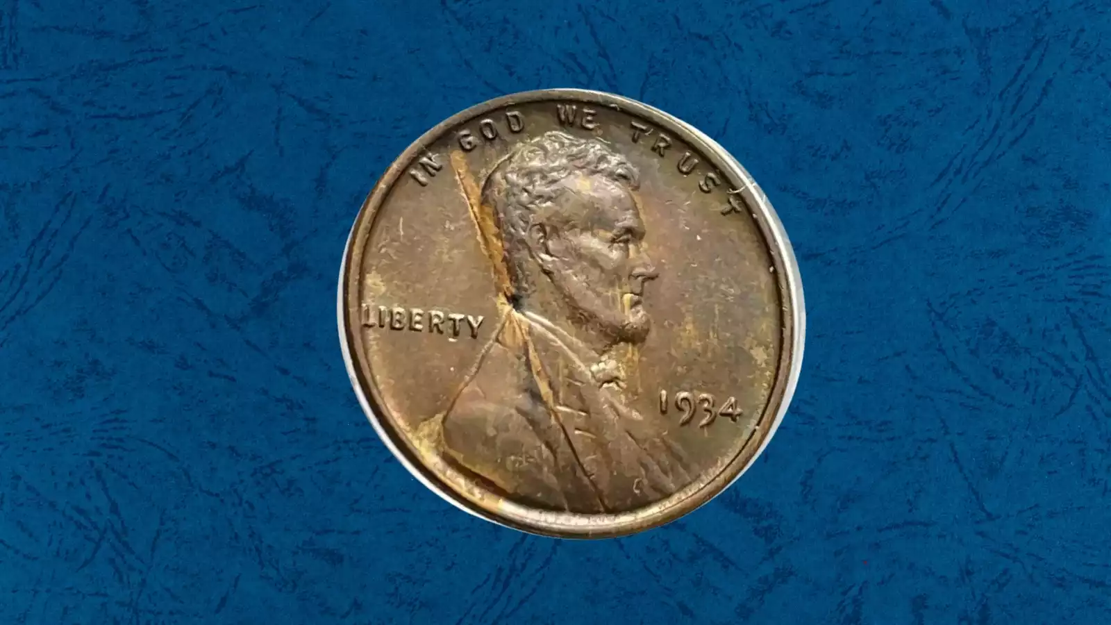 1934 Wheat Penny cud die break error showing raised unstruck blob of copper at the rim