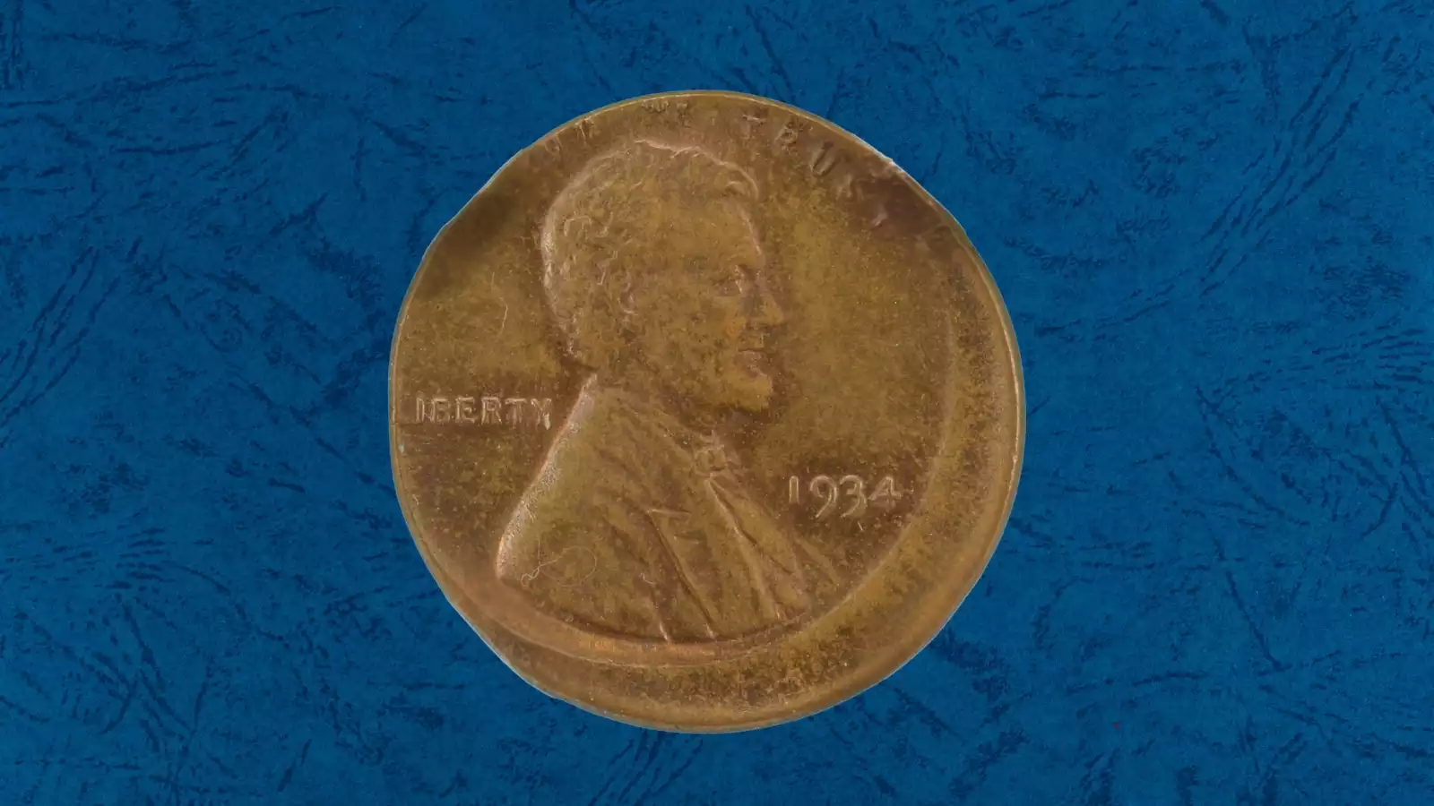1934 Wheat Penny off-center strike error with partial design and blank planchet visible